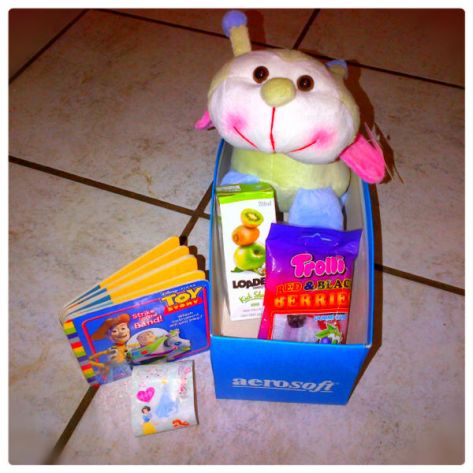 A typical comfort box contains a snack, juice, new stuffed toy (that was cuddled and blessed to carry some comfort before putting into the box), a book, sticker or colouring activity, toys for boys or girls.